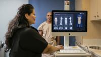 A patient has a mole mapping in order to be screened for skin cancer